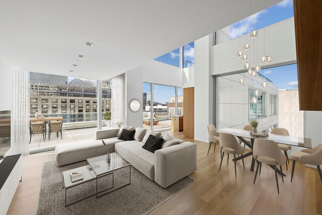 living area with light wood finished floors and baseboards