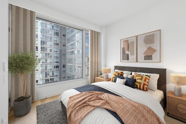 611 W 56th Street Maisonwest, New York City, NY 10019 - bedroom featuring wood finished floors