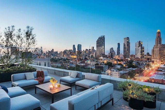 view of patio / terrace featuring outdoor lounge area and a skyline view