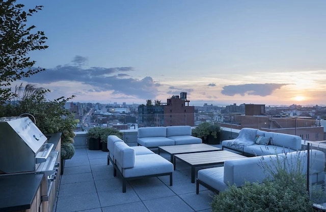 view of patio with an outdoor living space and a view of city