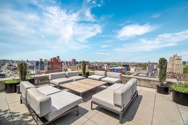 view of patio / terrace with an outdoor living space and a view of city