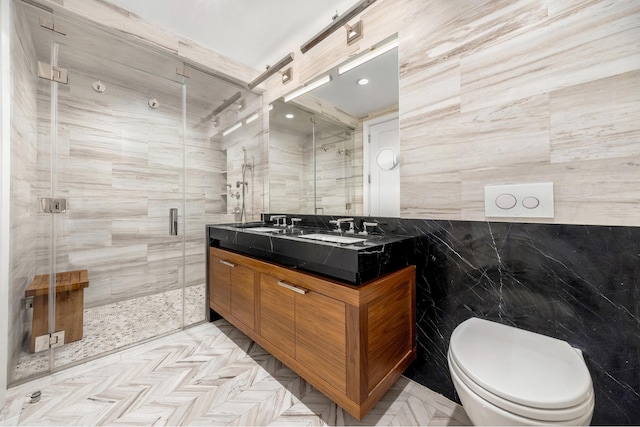 full bath featuring toilet, double vanity, tile walls, and a shower stall