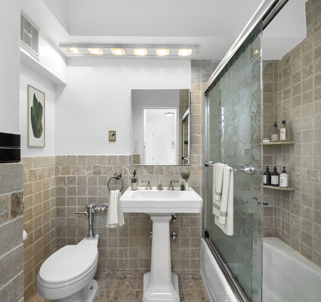 1160 3rd Ave Unit 17G, New York City, NY 10065 - full bath featuring tile walls and combined bath / shower with glass door