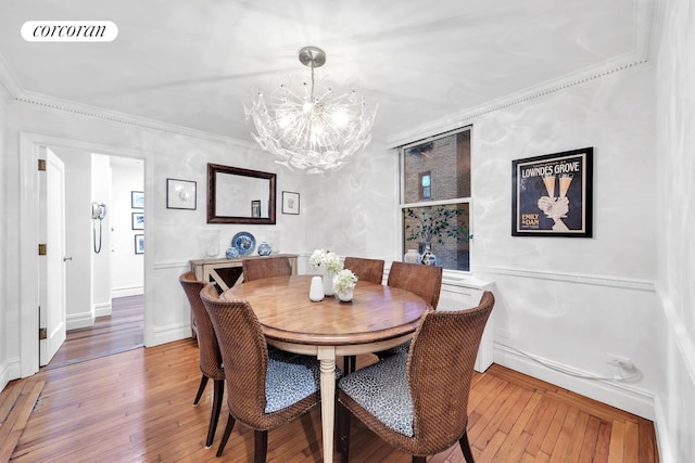 49 E 86th St Unit 3A, New York City, NY 10028 - dining area with a chandelier, hardwood / wood-style flooring, and ornamental molding