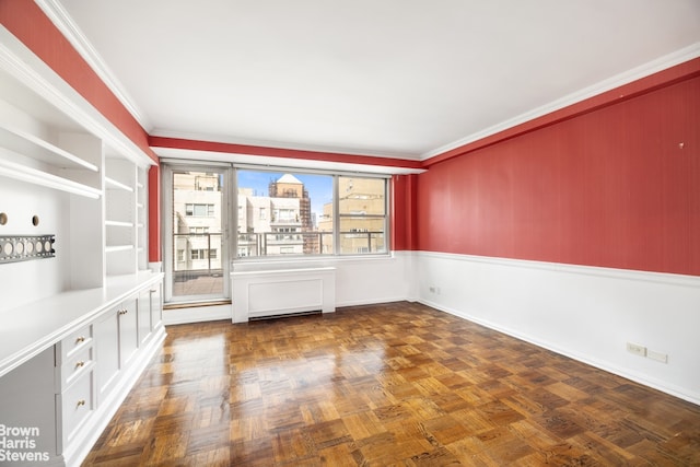 spare room featuring ornamental molding