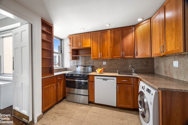 kitchen with dishwasher, stainless steel range with electric cooktop, washer / clothes dryer, open shelves, and a sink