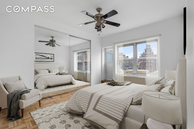333 E 66th St Pha, Pha, New York City, NY 10065 - bedroom with a ceiling fan and a view of city