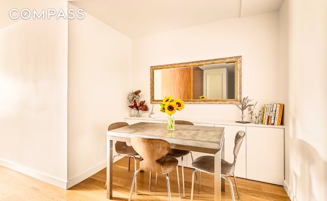 15 Charles St Unit 6G, New York City, NY 10014 - dining space with light wood-style floors and baseboards