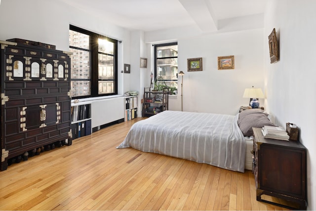 43 W 61st St Unit 16H, New York City, NY 10023 - bedroom featuring hardwood / wood-style floors and beamed ceiling