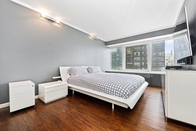 150 W 56th St Unit 3302, New York City, NY 10019 - bedroom featuring wood finished floors and baseboards