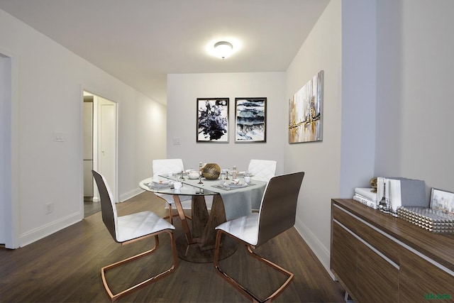 343 E 74th St Unit 7-J, New York City, NY 10021 - dining space with baseboards and wood finished floors