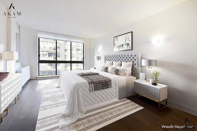 bedroom featuring baseboards and wood finished floors