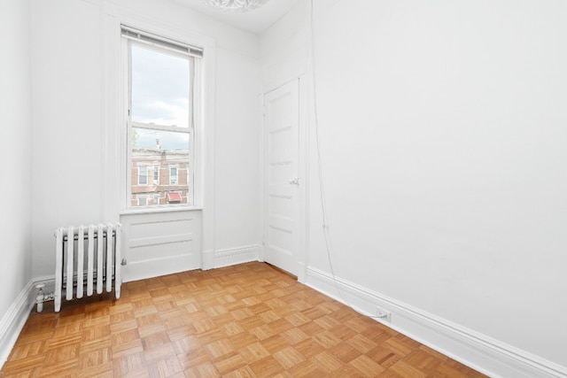 64-07 68th Ave, New York City, NY 11385 - unfurnished room with radiator and baseboards