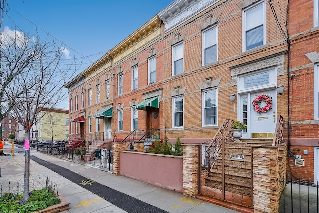 64-07 68th Ave, New York City, NY 11385 - view of building exterior with a fenced front yard and a residential view