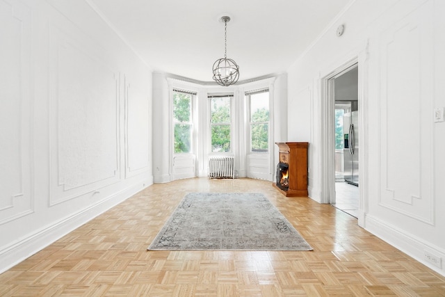 64-07 68th Ave, New York City, NY 11385 - unfurnished dining area featuring radiator heating unit, healthy amount of natural light, a chandelier, and baseboards