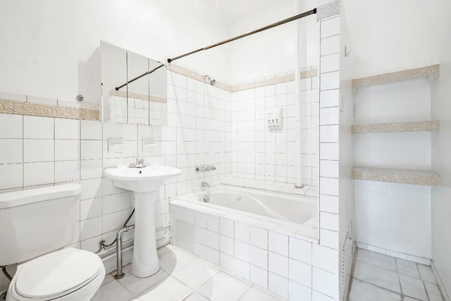 64-07 68th Ave, New York City, NY 11385 - full bathroom featuring toilet, tiled shower / bath, tile patterned floors, and tile walls