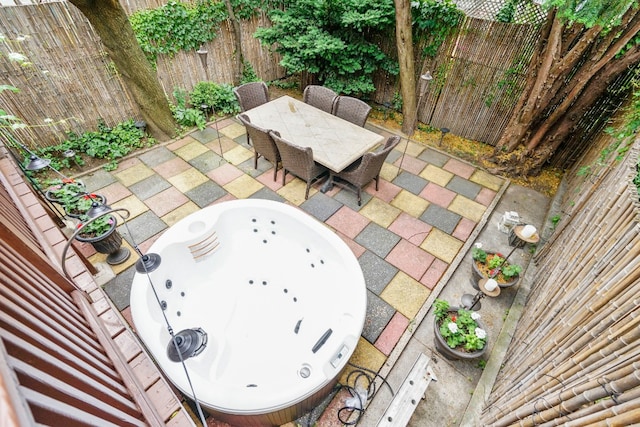 64-07 68th Ave, New York City, NY 11385 - fenced backyard with a patio area and outdoor dining area