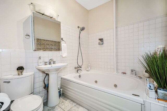 64-07 68th Ave, New York City, NY 11385 - full bathroom with tile walls, toilet, a combined bath / shower with jetted tub, marble finish flooring, and a sink