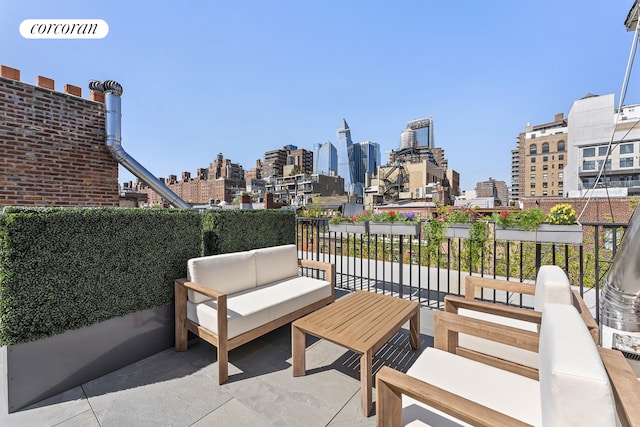 322 W 22nd St Unit 2, New York City, NY 10011 - view of patio / terrace featuring a skyline view and an outdoor hangout area