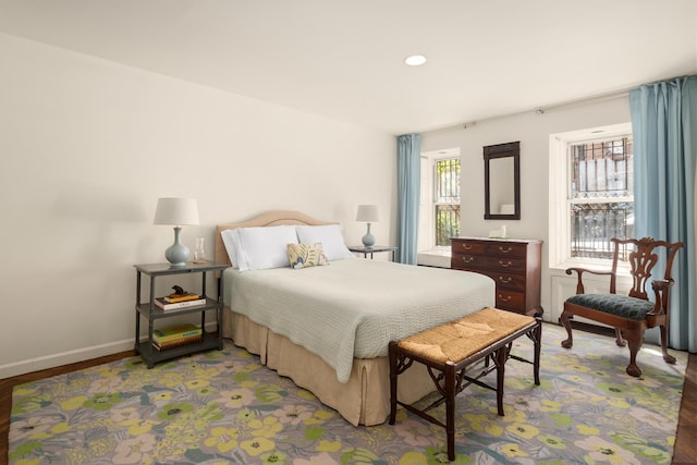 bedroom with recessed lighting, light wood-style flooring, and baseboards