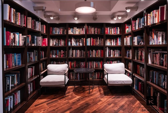 22 N 6th St Unit 20-D, New York City, NY 11249 - living area with wall of books and wood finished floors