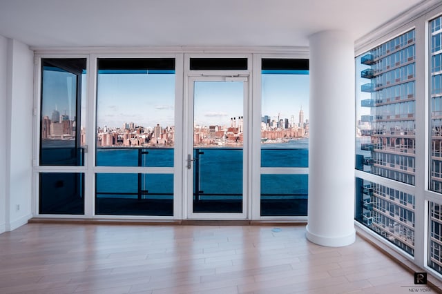 22 N 6th St Unit 20-D, New York City, NY 11249 - spare room with a city view and wood finished floors