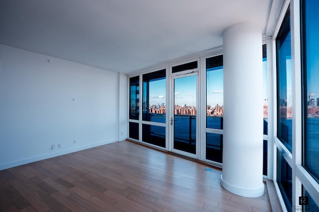 22 N 6th St Unit 20-D, New York City, NY 11249 - spare room with wood finished floors and floor to ceiling windows