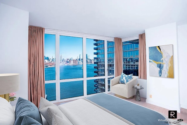 22 N 6th St Unit 20-D, New York City, NY 11249 - bedroom featuring a skyline view, a water view, and wood finished floors