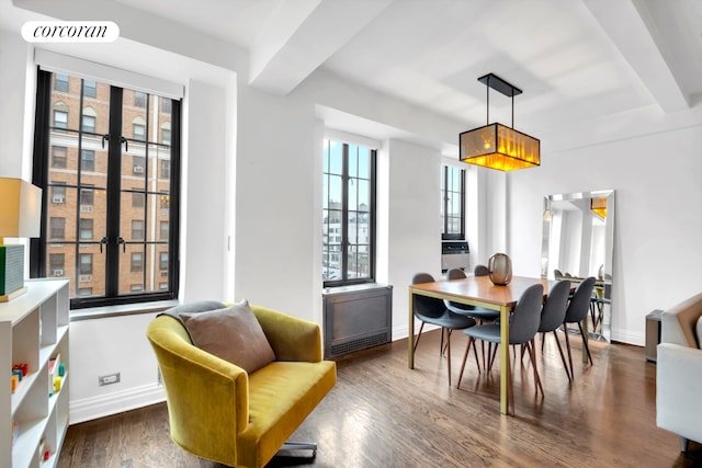201 W 16th St Unit 12Dg, New York City, NY 10011 - dining area with baseboards and dark wood-style flooring