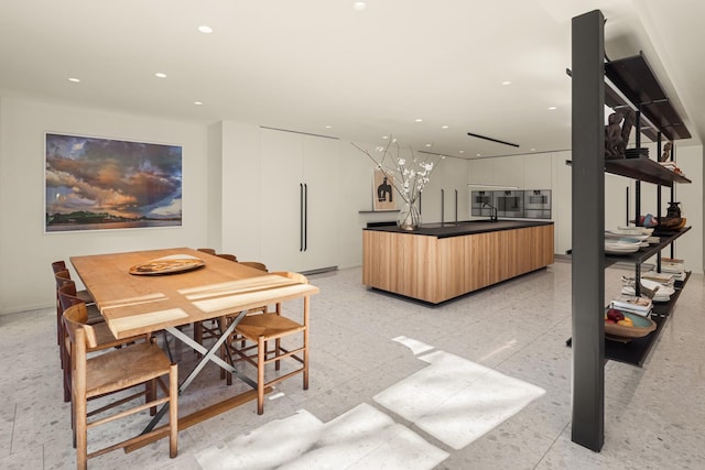 dining space with recessed lighting