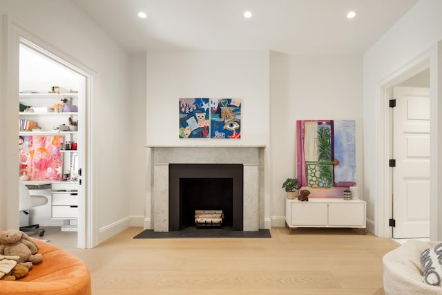 living room with recessed lighting and light wood-style flooring