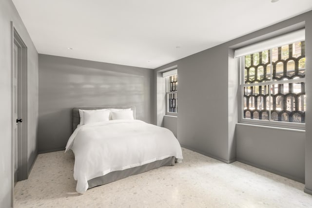 bedroom featuring baseboards
