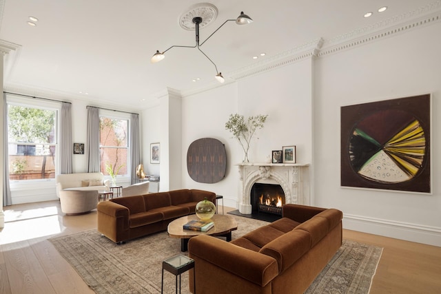 living room with recessed lighting, wood finished floors, and crown molding
