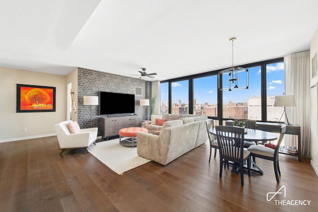 302 E 96th St Unit 1403, New York City, NY 10128 - living room with baseboards, healthy amount of natural light, ceiling fan, dark wood-style floors, and expansive windows