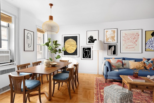 601 E 19th St Unit 2M, New York City, NY 11226 - dining area with radiator heating unit and baseboards
