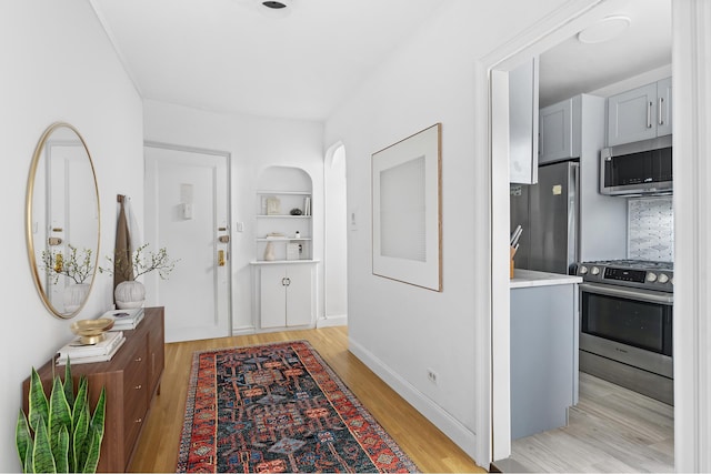601 E 19th St Unit 2M, New York City, NY 11226 - hallway with light wood-type flooring and built in features
