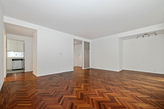 empty room featuring baseboards