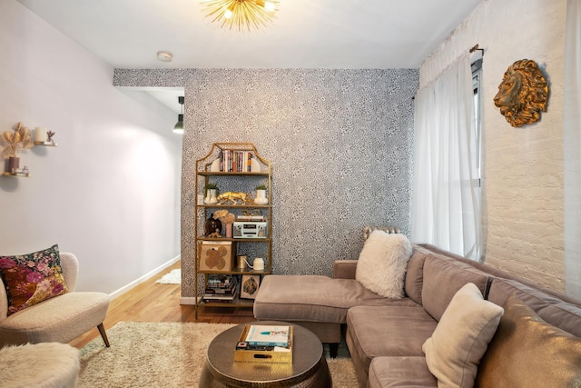 living area featuring wood finished floors and baseboards