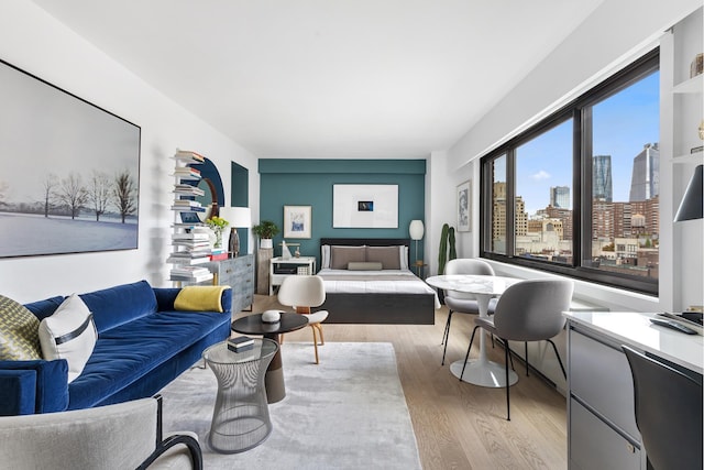 living room with a city view and wood finished floors
