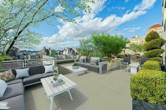view of patio with outdoor lounge area and a view of city
