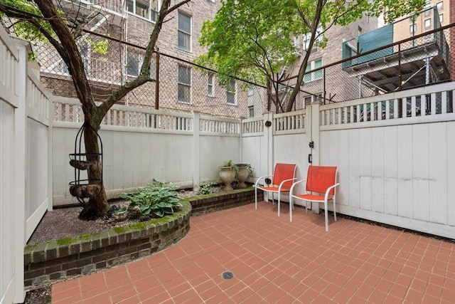 59 E 73rd St, New York City, NY 10021 - fenced backyard featuring a patio area