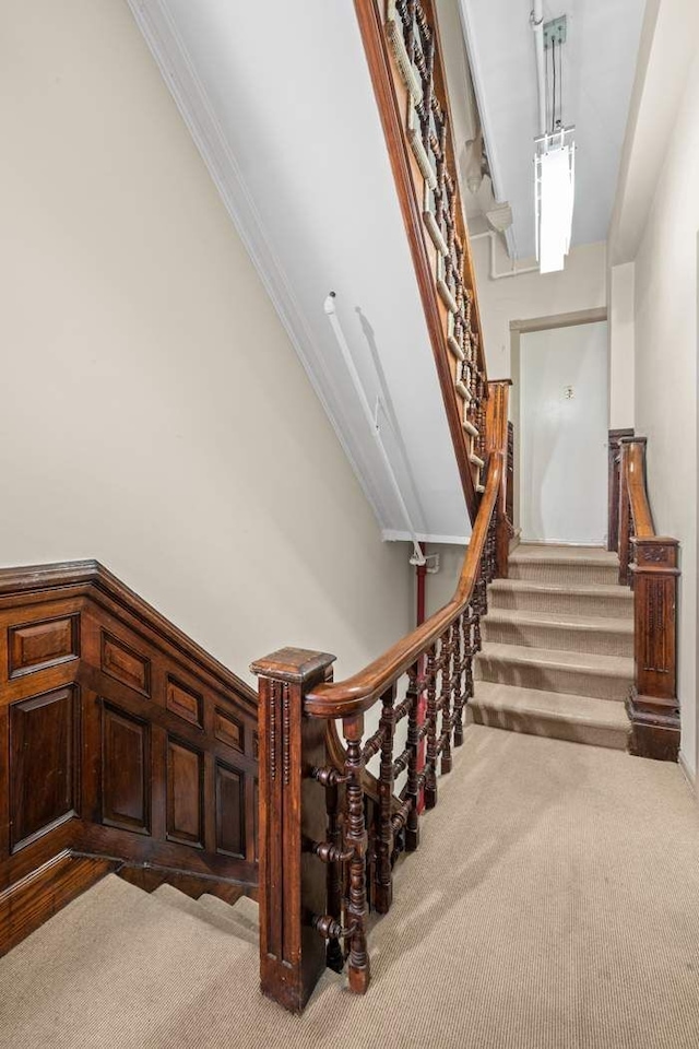 59 E 73rd St, New York City, NY 10021 - stairs with carpet floors and ornamental molding