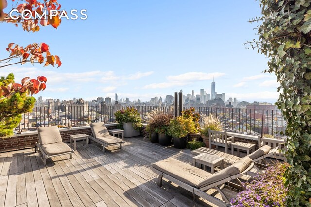 302 W 12th St Unit 5G, New York City, NY 10014 - wooden terrace with a view of city
