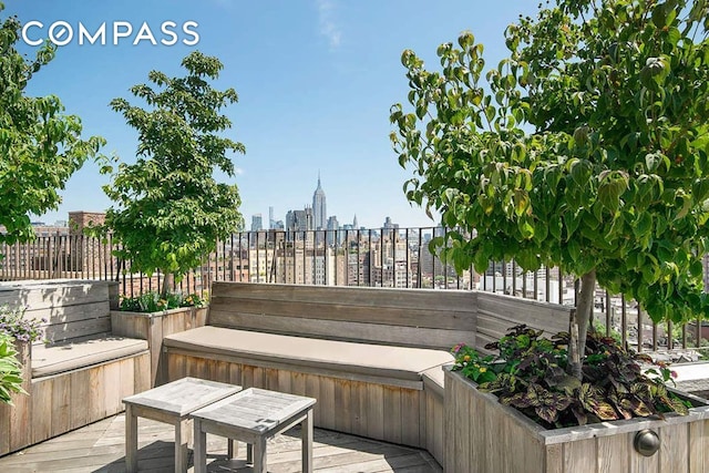 302 W 12th St Unit 5G, New York City, NY 10014 - wooden deck with fence and a city view