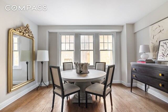 302 W 12th St Unit 5G, New York City, NY 10014 - dining area featuring baseboards and light wood-style flooring