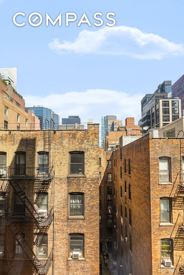 view of apartment building / complex with a city view