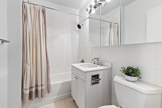 bathroom featuring toilet, shower / tub combo with curtain, vanity, and tile walls