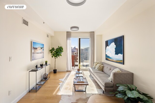 236 17th St Unit 6C, New York City, NY 11215 - living area featuring light wood-style flooring and baseboards