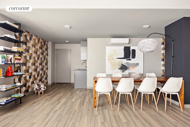 236 17th St Unit 6C, New York City, NY 11215 - dining room featuring a wall mounted AC, light wood-style floors, and baseboards