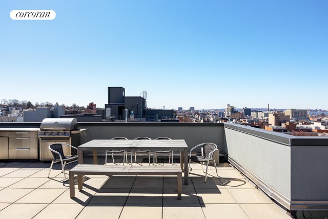 236 17th St Unit 6C, New York City, NY 11215 - view of patio with a city view, a grill, a balcony, and outdoor dining area